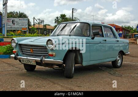 Old car 1960`s build, but great maintained French Peugeot car, in its original car color, seen in Ghana, West Africa, side view Stock Photo